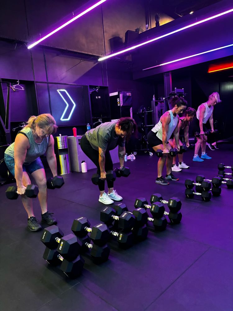A class working through dumbbell rows